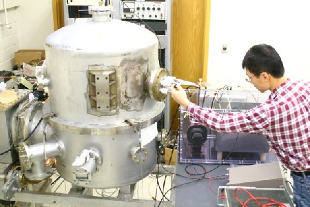 Student adjusting lab equipment