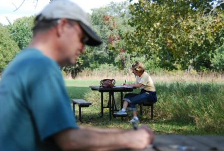 Robert Brooke and Mary Klucas writing in the sunshine at Platte River State Park