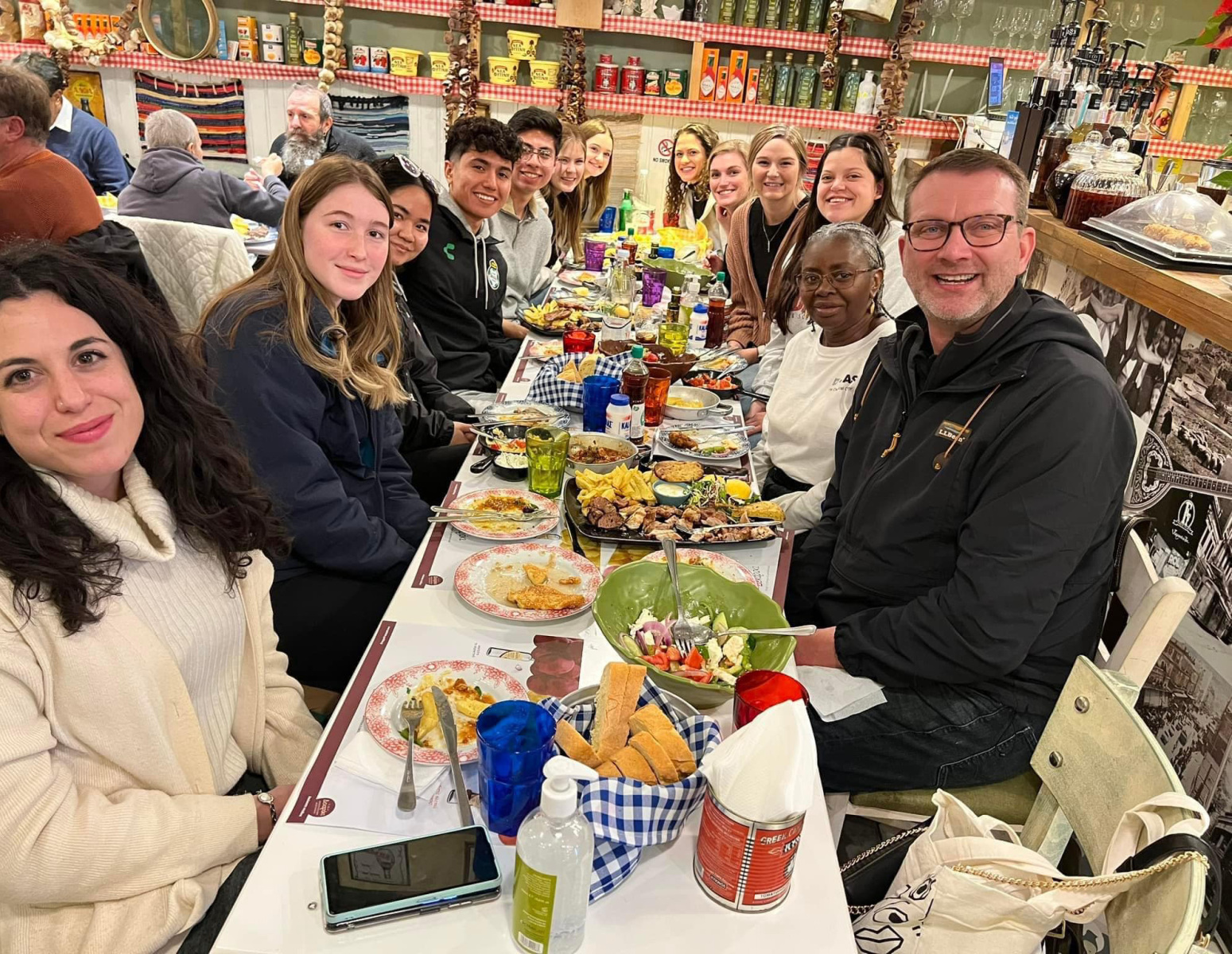 Students and Instructors at a table with food