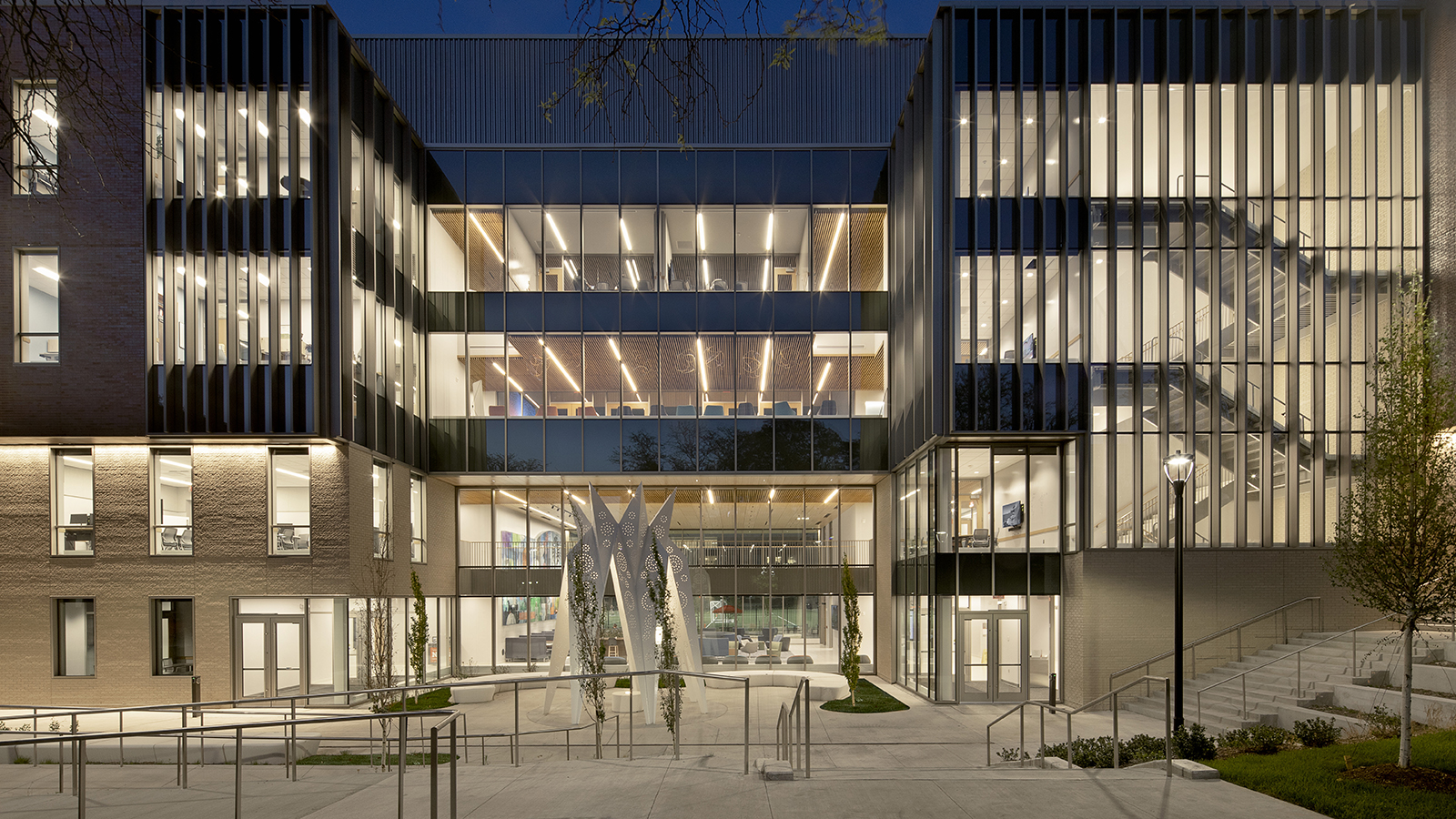 view of Carolyn Pope Edwards Hall lit up at night