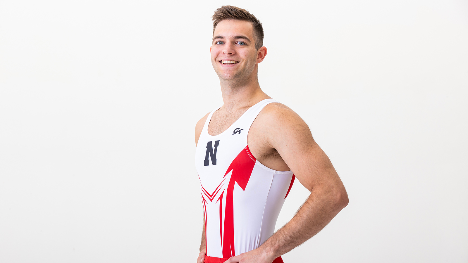 Cooper Giles professional headshot in his Husker men's gymnastics uniform