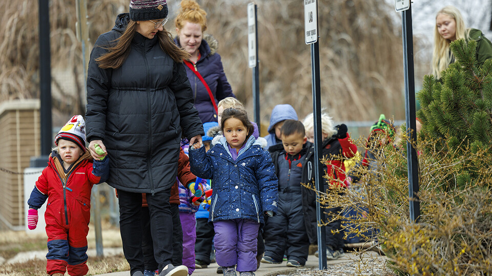 Mollie Von Kampen leads the children on a field trip.