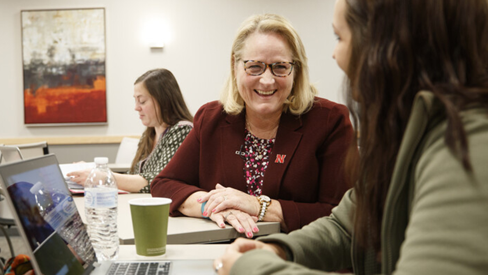 Sheree Moser smiles while working with a student in her class