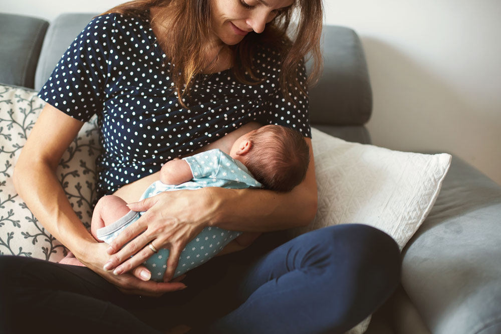 parent breastfeeding a baby