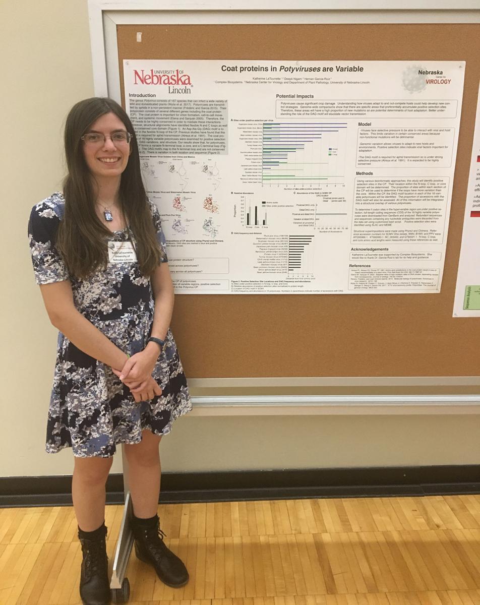 a student presenting her poster
