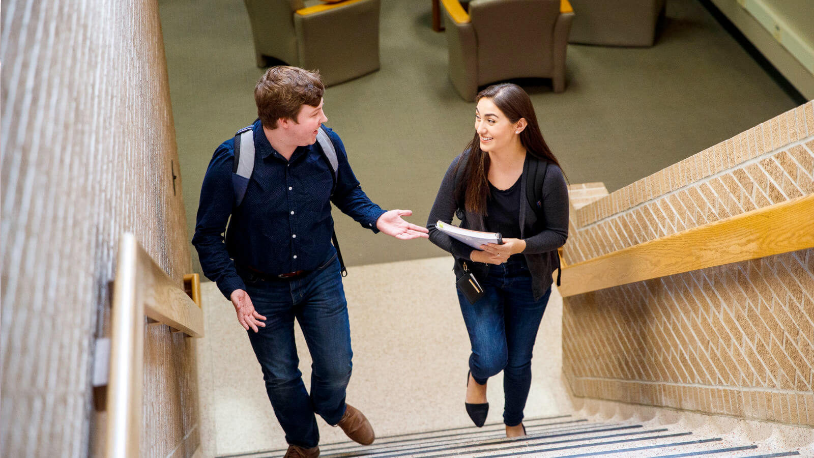 Students walking up stairs and talking