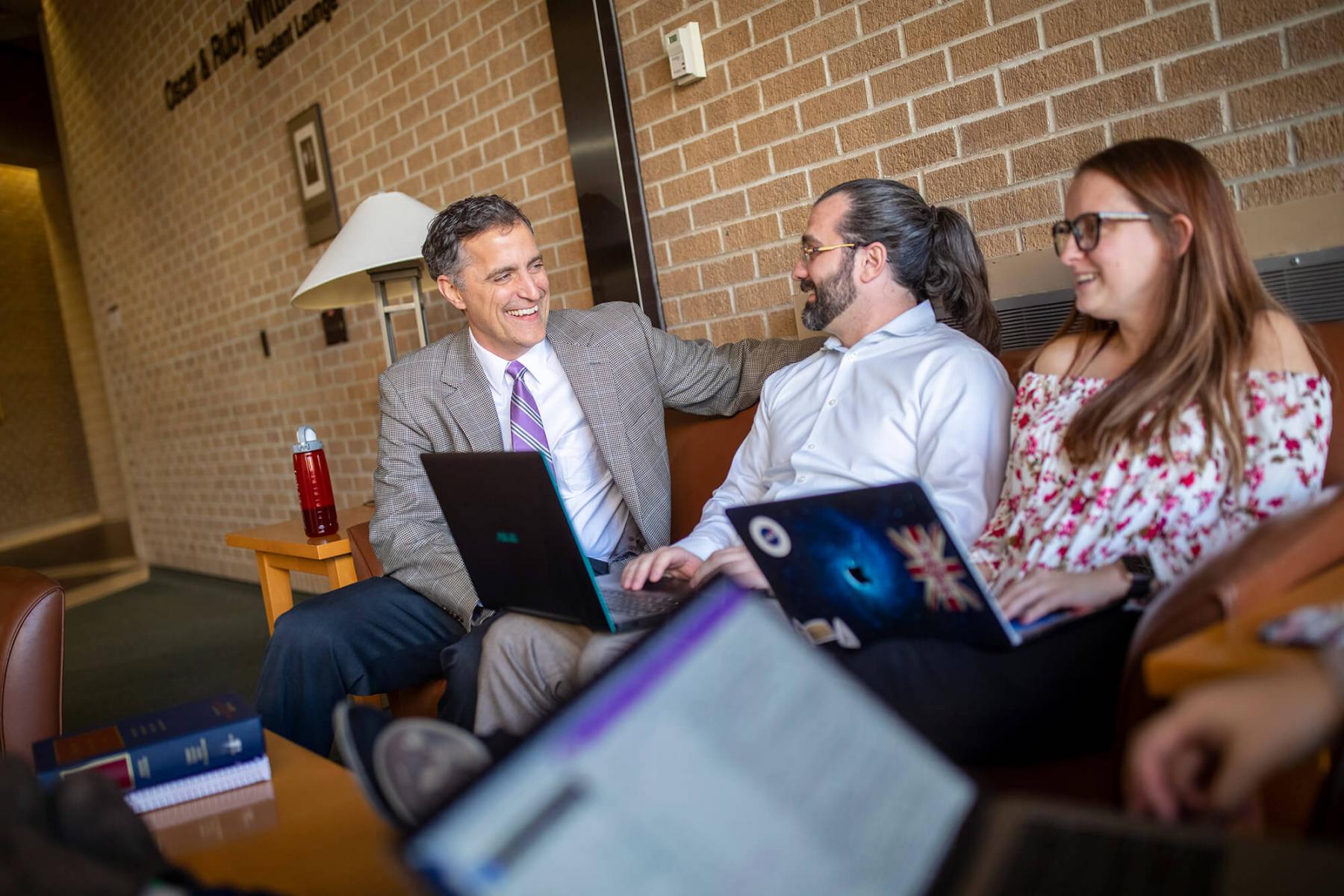 Students talking with Dean of College