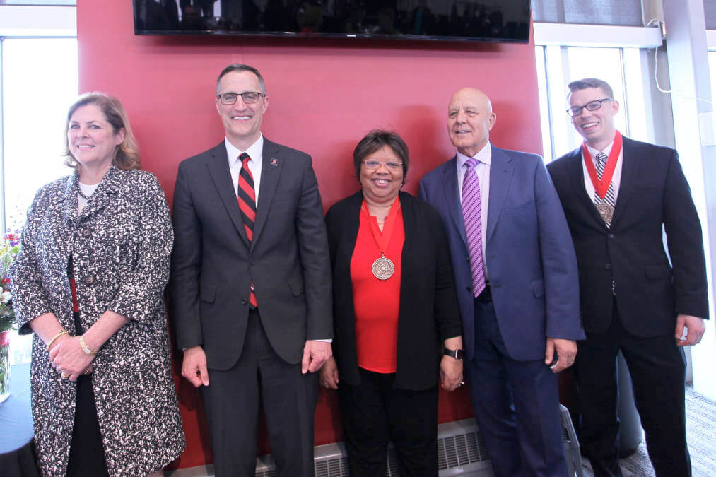 Faculty and students pose for photo at awards banquet