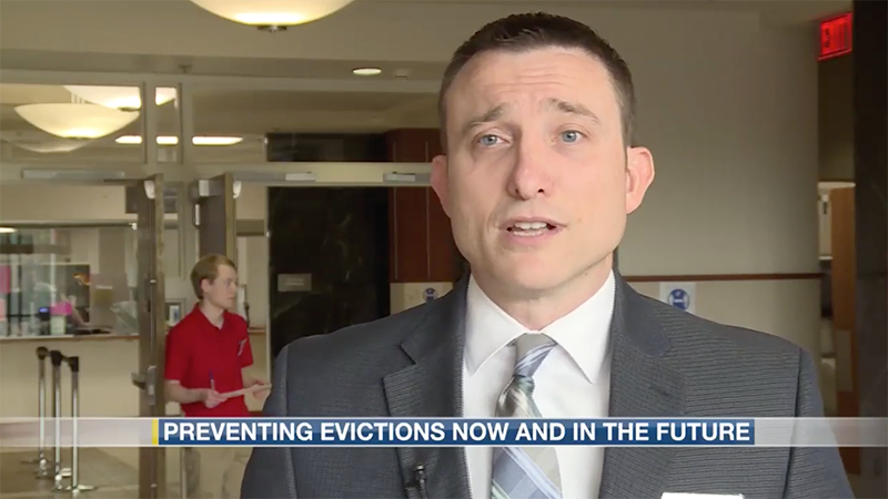 Ryan Sullivan being interviewed in the lobby of the courthouse